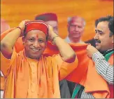  ?? RAVI KUMAR/HT ?? ▪ Uttar Pradesh CM Yogi Adityanath along with BJP’s Arki candidate Rattan Singh Pal (right) and the sitting MLA Govind Thakur during a party rally at Jainagar village in Solan on Sunday.