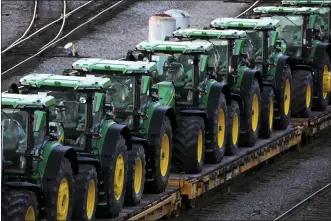  ?? GENE J. PUSKAR - THE ASSOCIATED PRESS ?? A consist of John Deere tractors in Norfolk Southern’s Conway Yard in Conway, Pa., on Dec. 5. On Thursday, the Labor Department reported the producer price index for January surged.