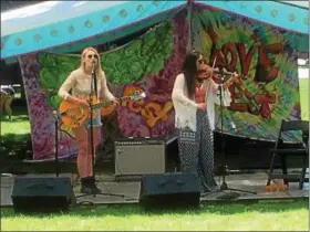  ?? ANDREW CASS — THE NEWS-HERALD ?? The Willow Tree performs at Love Fest on Chardon Square July 7.