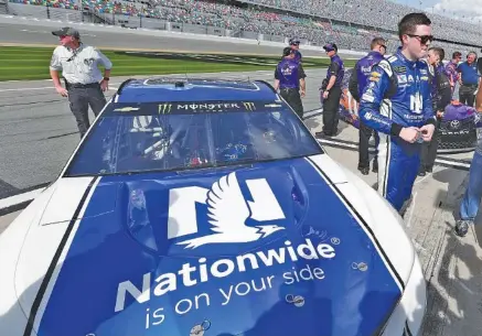  ?? THE ASSOCIATED PRESS ?? Alex Bowman, right, stands by the Hendrick Motorsport­s No. 88 Chevrolet Camaro on pit road at Daytona Internatio­nal Speedway after he won the pole position during Sunday’s qualifying for the Daytona 500. “The Great American Race” is next Sunday.