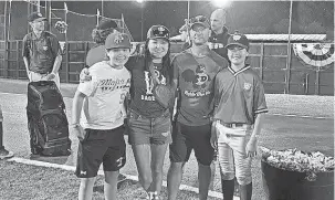  ?? COURTESY OF THE ANTOLIK FAMILY ?? Dana Yoo, center left, poses, left to right, with her son Caius, husband Chris and son Marcus at a tournament in Cooperstow­n, New York, during the summer of 2022.