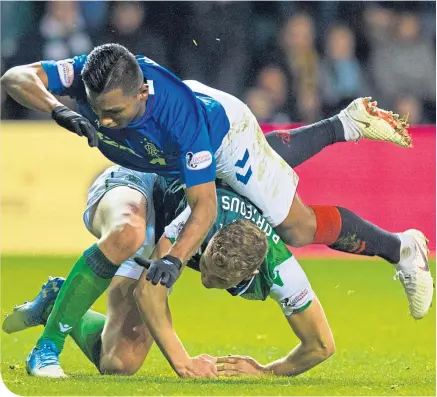  ??  ?? Alfredo Morelos was on the end of this challenge by Ryan Porteous but there was no petulant reaction