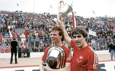  ?? ?? Top: Alex McLeish and Mark McGhee with the Scottish Cup after their victory in the 1983 final, which happened 10 days after Gothenburg.