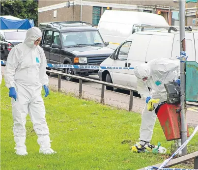  ?? Picture: Steven Brown. ?? Forensic officers at work in Dundee. The city has seen a significan­t spike in murders during the last 12 months.