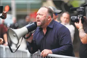  ?? Houston Chronicle ?? Alex Jones, of InfoWars, yells at protestors outside of Toyota Center before a Trump campaign rally, Monday, October 22, 2018, in Houston.