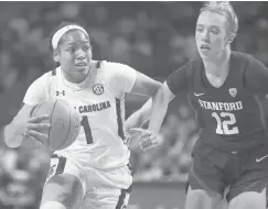  ?? SEAN RAYFORD/AP ?? South Carolina guard Zia Cooke (1) dribbles the ball as Stanford guard Lexie Hull defends during the first half Tuesday in Columbia, South Carolina.