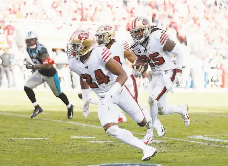  ?? Lachlan Cunningham / Getty Images ?? 49ers cornerback Richard Sherman returns the ball 21 yards to the Carolina 10yard line after his thirdquart­er intercepti­on.