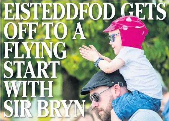  ?? ALED LLYWELYN ?? A youngster enjoys the ride at the National Eisteddfod of Wales in Cardiff Bay