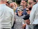  ?? MAYA ALLERUZZO/AP ?? The mother of Israeli Col. Roi Levy cries during her son’s funeral at the Mount Herzl cemetery in Jerusalem on Monday. Levy was killed after Hamas militants stormed from the blockaded Gaza Strip into nearby Israeli towns.