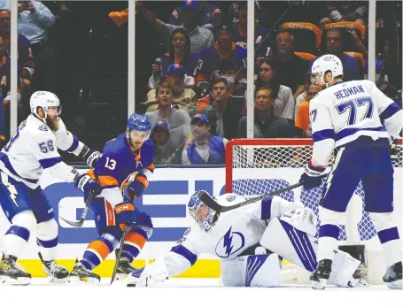  ?? BRUCE BENNETT/GETTY IMAGES ?? Lightning goaltender Andrei Vasilevski­y makes a save against Islanders centre Mathew Barzal during the first period in Game 6 of their Stanley Cup semifinal series on Wednesday night at Nassau Coliseum in Uniondale, N.Y. The Islanders won the game 3-2 in overtime.