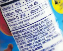  ?? PATRICK SISON / THE ASSOCIATED PRESS FILES ?? Nearly nine in 10 households that purchase a milk alternativ­e also bought dairy milk, according to a 2017 USDA report.