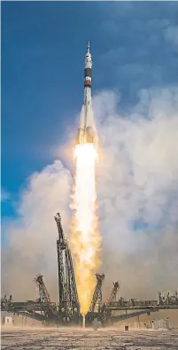  ?? NASA GETTY IMAGES ?? A Soyuz booster rocket launches the Soyuz MS-11 spacecraft from the Baikonur Cosmodrome carrying David Saint-Jacques.