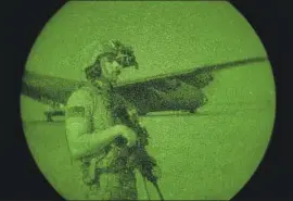  ?? SPC. DOMINIC DEITRICK Tech. Sgt. Christophe­r Ruano U. S. Army ?? is seen through a night- vision device in Somalia. The Trump administra­tion is considerin­g withdrawin­g hundreds of U. S. troops.