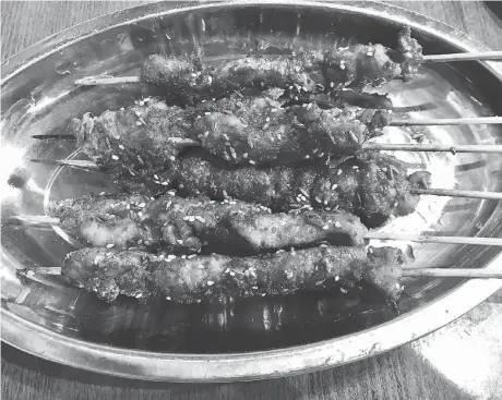  ?? PHOTOS: PETER HUM ?? Lamb skewers are a fine treat at Chinese Dragon BBQ.