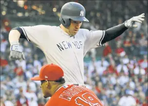  ??  ?? THE NEIL DEAL: Neil Walker, safe at first base, went 2-for-5 with two RBIs and two runs scored in the Yankees’ 11-1 win over the Angels on Saturday. He is looking to keep his spot on the roster with players nearing returns from the DL.