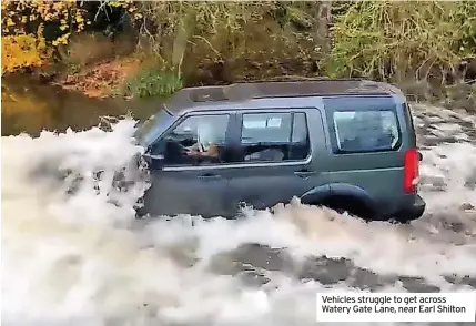  ?? ?? Vehicles struggle to get across Watery Gate Lane, near Earl Shilton