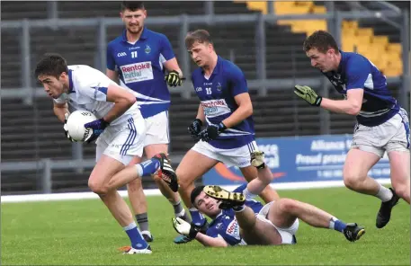  ??  ?? Templenoe’s Adrian Spillane gains possession against Laune Rangers trio of Fiachra Clifford, Shane McSweeney and John Tyther in the County Intermedia­te Football Championsh­ip semi-final in Fitzgerald Stadium, Killarney on Saturday. Photo by Michelle...