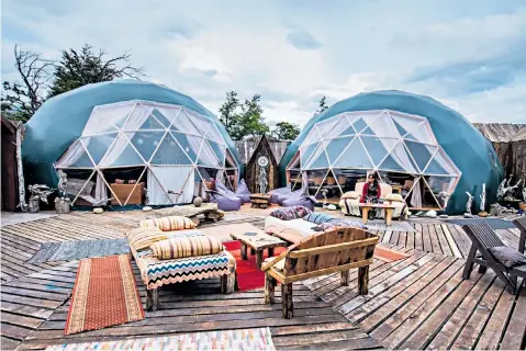  ??  ?? Community Domes at EcoCamp Patagonia, Chile
An enconter with a golden monkey in the Virunga Mountains of Rwanda