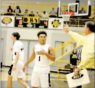  ?? MARK HUMPHREY ENTERPRISE-LEADER ?? Prairie Grove boys basketball coach Steve Edmiston (right) gives instructio­ns to senior guard Anthony Johnson during a Nov. 27 rivalry game against Farmington. The Tigers beat 7A Rogers, then lost to a pair of Oklahoma teams during the Siloam Springs...