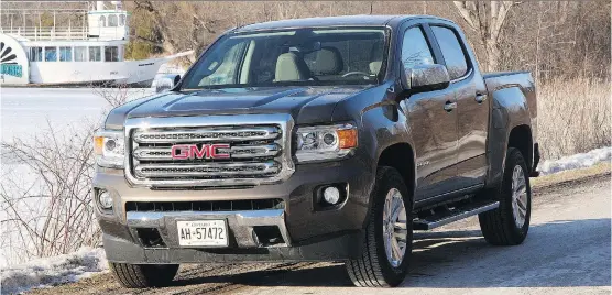 ?? PHOTOS: LESLEY WIMBUSH/ DRIVING ?? The 2015 GMC Canyon SLT 4WD is as tough- looking as GM’s full- size haulers and its crew- size cabin can genuinely handle four adults.