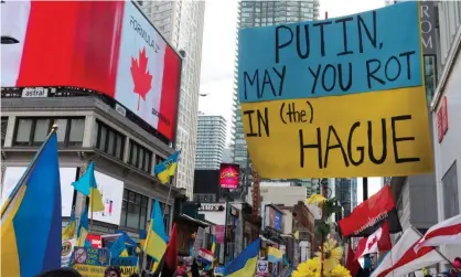  ?? ?? Anti-Putin slogan at a rally in Toronto, Canada. Photograph: Anatoliy Cherkasov/NurPhoto/Rex/Shuttersto­ck