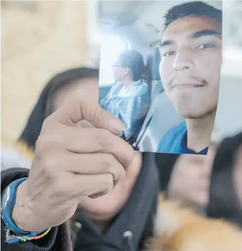  ?? LIAM RICHARDS / THE CANADIAN PRESS ?? Debbie Baptiste, mother of Colten Boushie, holds a picture of her son during a recess at the trial of Gerald Stanley on Monday in Battleford, Sask. Stanley is accused of killing the 22-year- old Indigenous man.