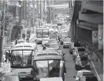  ??  ?? BACK TO NORMAL – The portion of EDSA in Quezon City, practicall­y empty during the long All Saints’ Day weekend, is once jammed Sunday with buses bringing people back from the provinces. (Alvin Kasiban)