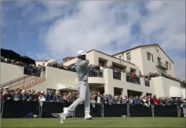  ?? RYAN KANG — ?? Dustin Johnson tees off on the first hole during the final round of the Genesis Open golf tournament at Riviera Country Club on Feb. 19.