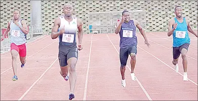  ?? (Pics: Ntokozo Magongo) ?? Sprinter Sibusiso ‘Swazi Bolt’ Matsenjwa leads towards the finish line in the 200m on Saturday during the 2022 Athletics Eswatini Track and Field National Championsh­ips at Mavuso Sports Centre.