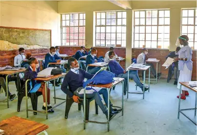  ?? /Gallo Images ?? Pupils at Nhlanhlaye­thu Secondary School. Many schools in the province were damaged during the recent unrest.