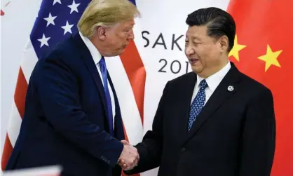  ?? Photograph: Brendan Smialowski/AFP/Getty Images ?? The US president, Donald Trump, shakes hands with China’s president, Xi Jinping, before a meeting in June 2019.