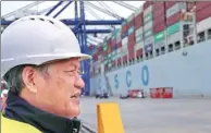  ?? XINHUA ?? Fu Chengqiu, president of Piraeus Container Terminal SA, inspects operations at Piraeus port in Athens, Greece, on Monday.