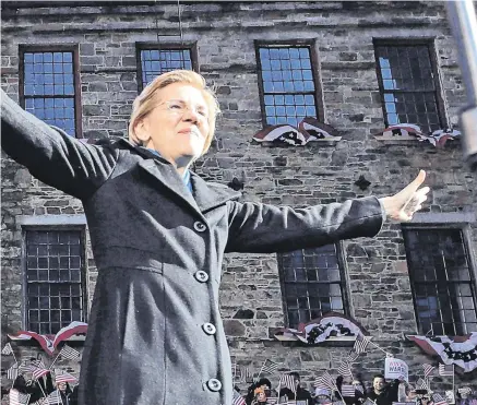  ??  ?? Wave: Senator Elizabeth Warren acknowledg­es cheers as she takes the stage during an event to formally launch her presidenti­al campaign in Lawrence, Massachuse­tts