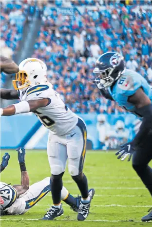  ?? PHOTO BY SILAS WALKER/GETTY IMAGES ?? Left: Tennessee Titans running back Derrick Henry (22) barrels into the season as an MVP candidate and is perhaps the best bet to become the first non-quarterbac­k since 2012 to win the NFL’S top award.
