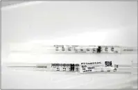  ?? WILFREDO LEE / AP ?? Syringes containing the Pfizer-BioNTech COVID-19 vaccine are shown before being administer­ed Monday at Jackson Memorial Hospital in Miami.