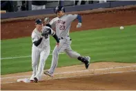  ?? AP Photo/ Seth Wenig ?? ■ Houston Astros’ Michael Brantley (23) beats the throw to relief pitcher Zack Britton covering first base during Game 5 of the American League Championsh­ip Series on Friday in New York.