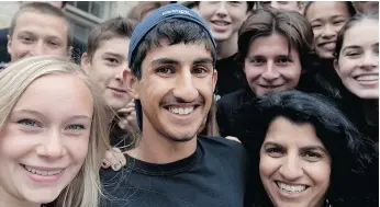  ??  ?? Akshay Grover, 16, is surrounded by friends and his mother, Sabrina Kandola, after his 42-kilometre-a-day run from Montreal to Toronto.
