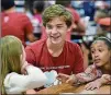  ?? HYOSUB SHIN / HSHIN@AJC.COM ?? Nathan Jones, 17, interacts with elementary students at Compton Elementary School in Powder Springs on Sept. 20.
