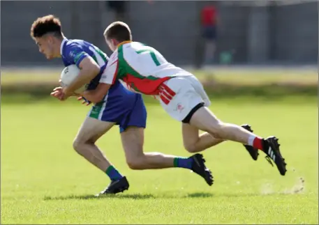  ??  ?? AGB’s Peter Hempenstal­l battles with Kiltegan’s Liam Keogh in Joule Park Aughrim.