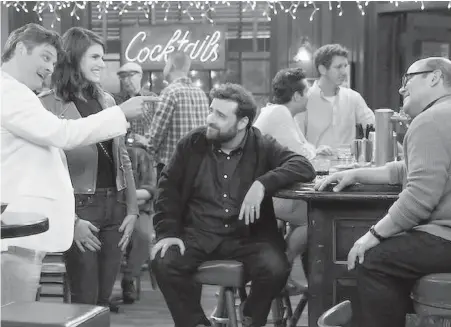  ??  ?? Jay R. Ferguson, left, as the reporter who decides he’s going to live by the Bible in Living Biblically.