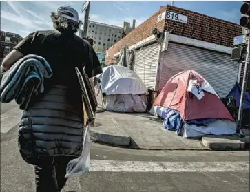  ?? Photograph­s by Robert Gauthier Los Angeles Times ?? IF SKID ROW gets swept clean, Steve Lopez writes, where do you think all the people who live there now but aren’t ready or willing to move into temporary quarters are going to end up? Probably elsewhere in L.A.