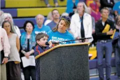  ??  ?? Keelan Ranney-Smith, 9, and his mom, Lucy Ranney of Santa Fe, address the Santa Fe County Commission in opposition to the truck stop.