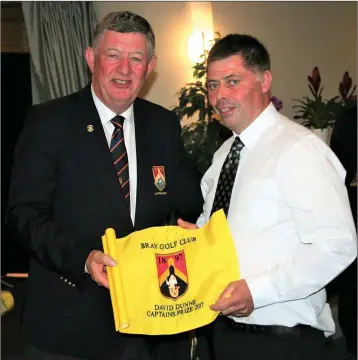  ??  ?? The winner of the Bray golf Club Captain’s Prize Paul McGlone being presented with his prize by Captain David Dunne.