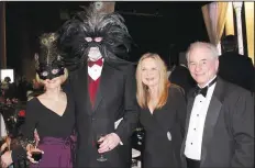  ?? NWA Democrat-Gazette/CARIN SCHOPPMEYE­R ?? Terry and Mike Johnson (from left) and Marti and Kelly Sudduth visit at the Masquerade Ball.