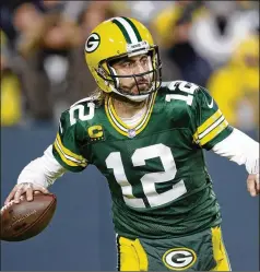  ?? MATT LUDTKE/AP ?? Packers quarterbac­k Aaron Rodgers, the reigning MVP, went 29 of 37, throwing two TD passes to Davante Adams and one each to Allen Lazard and Aaron Jones, in Sunday’s win against the Chicago Bears in Green Bay.