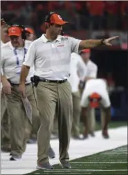  ?? JEFFREY MCWHORTER - THE ASSOCIATED PRESS ?? Clemson head coach Dabo Swinney instructs his team in the first half of the NCAA Cotton Bowl semi-final playoff football game against Notre Dame on Saturday, Dec. 29, 2018, in Arlington, Texas.