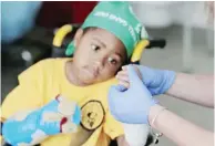  ?? AFPPIX ?? A nurse checks the newly transplant­ed hands of Harvey at Children’s Hospital of Philadelph­ia in Pennsylvan­ia on July 29, 2015.