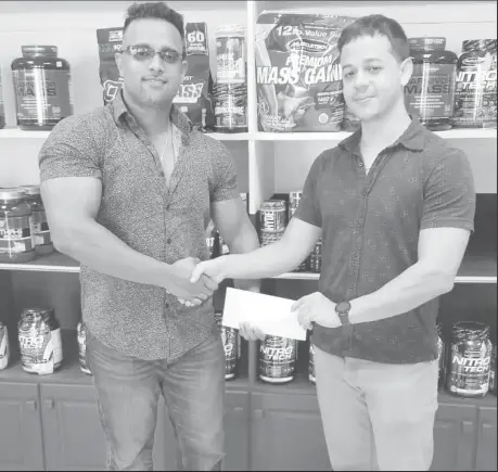  ??  ?? Fitness Express’ Darren McDonald (right) recently presented a cheque for a substantia­l sum to GBBFFI’s Vice President, Seeon Satrohan.