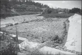  ?? ALEJANDRO TAMAYO/SAN DIEGO UNION-TRIBUNE ?? In Colonia Cajon de la Pedrera the canal flows with sewage water into a storm drain reservoir on June 30, 2020 in Tijuana. California reservoirs are now halfempty and dryness has reached historic drought levels.