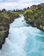  ??  ?? Fast and furious: The luminous blue waters of the Waikato River roar towards Huka Falls.